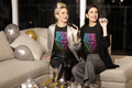 Pulse neon drip black women's graphic tee two women singing at NYE party