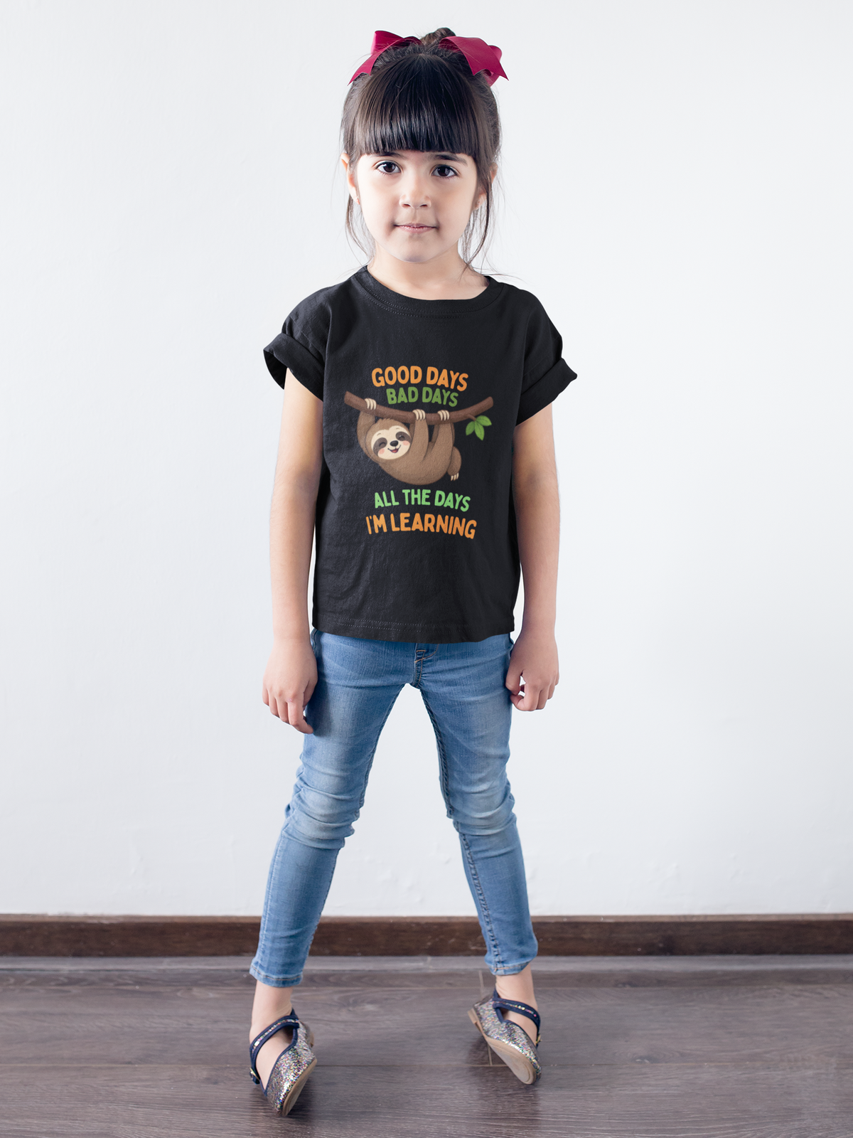 Mini Learning Sloth Tee Black - little girl against white wall
