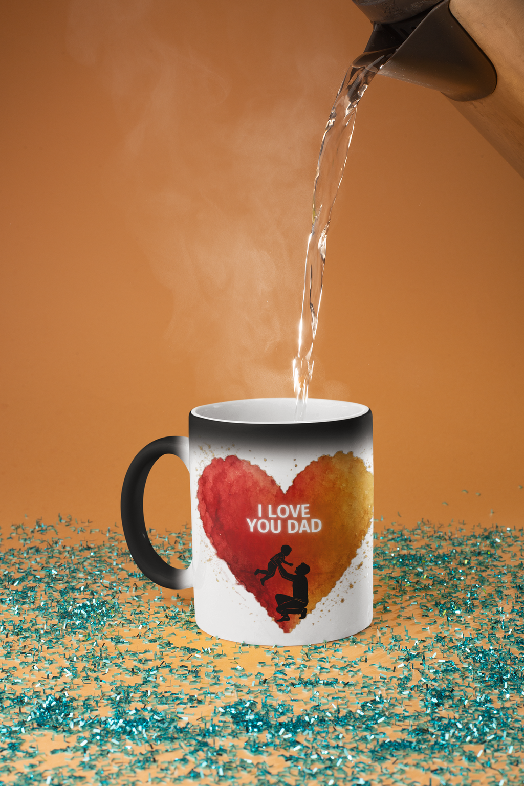 Mockup of a black colour-changing mug as hot water is poured in, revealing a heart with I LOVE YOU DAD and a father-and-child silhouette.