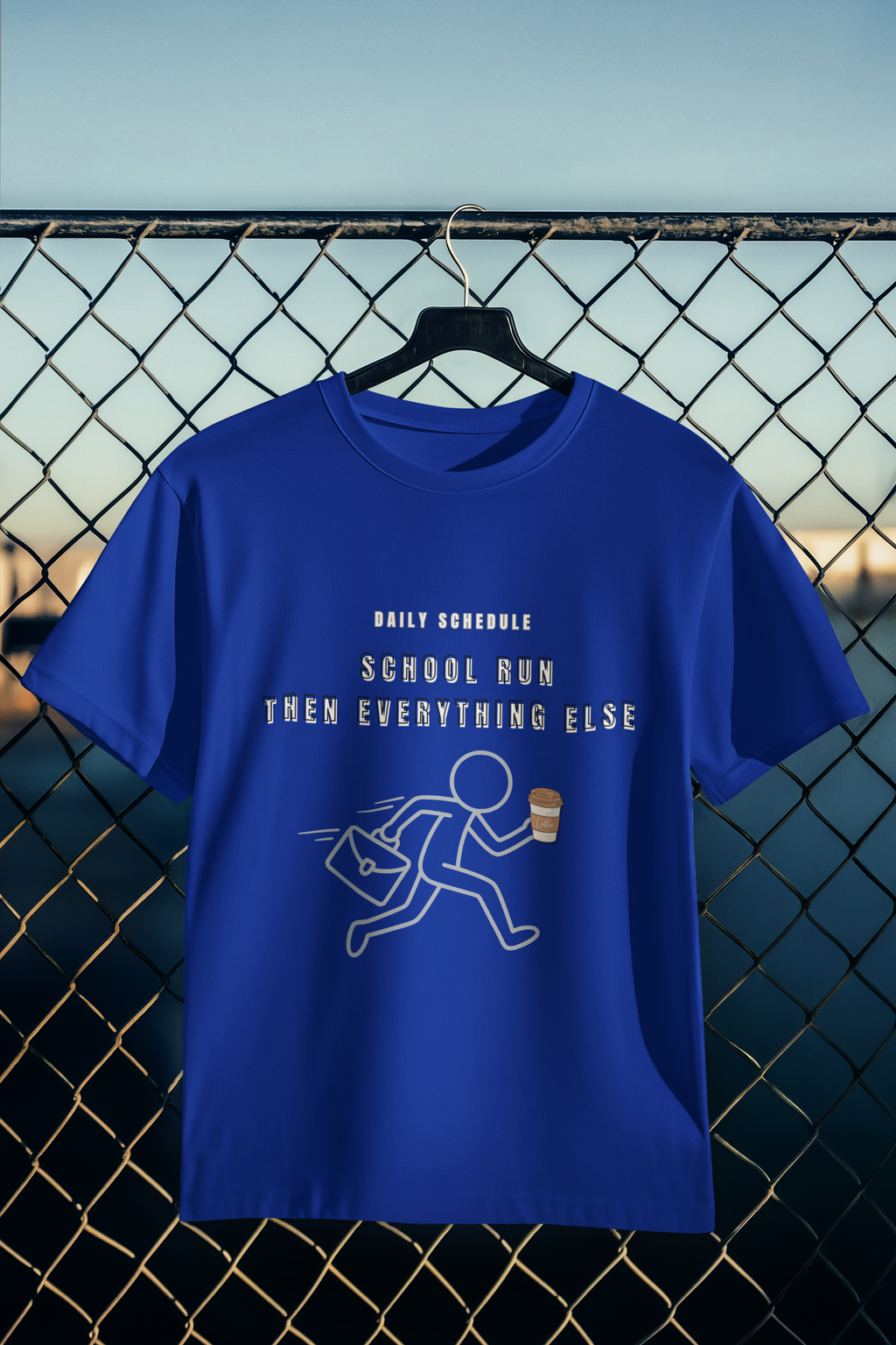 School Run Then Everything Else blue tee hanging on wire fence