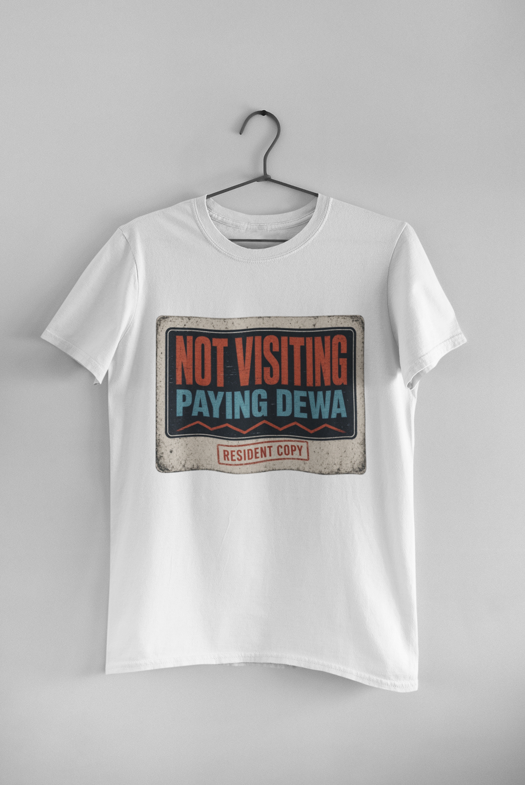 Not Visiting Paying DEWA black unisex tee hanging on wall