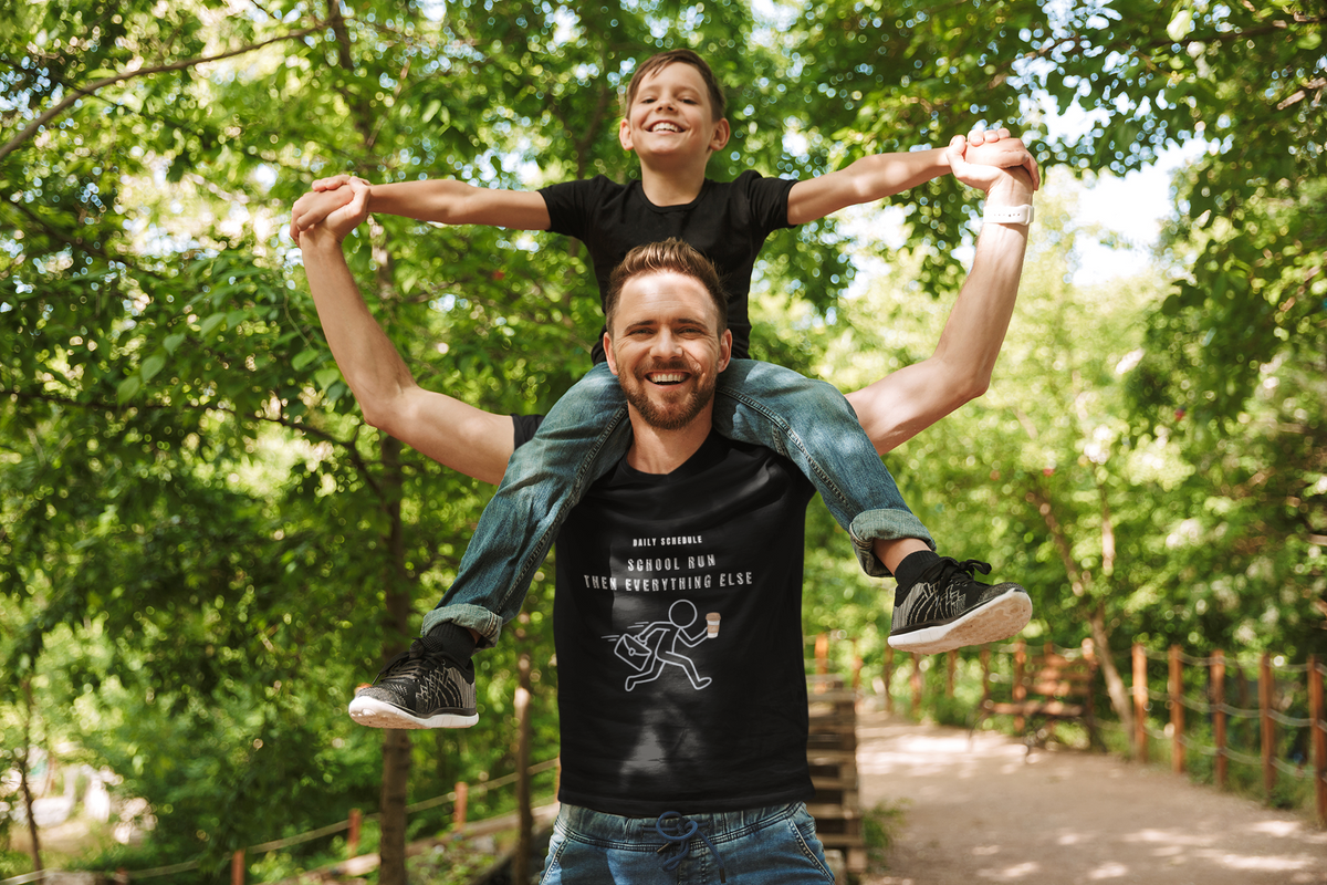 School Run Then Everything Else black tee dad carrying son on shoulders park