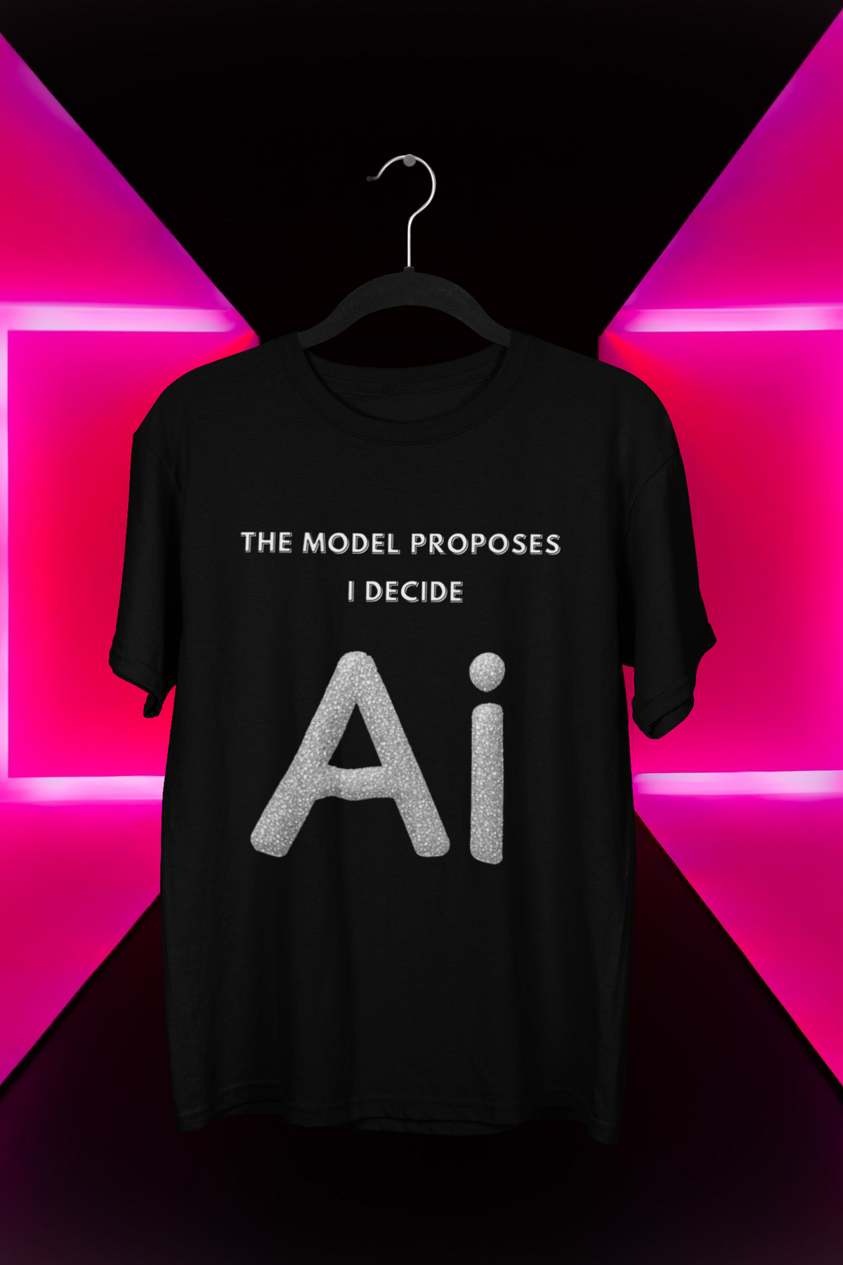 Black T-shirt on a hanger with silver-looking AI lettering and The model proposes, I decide above it.