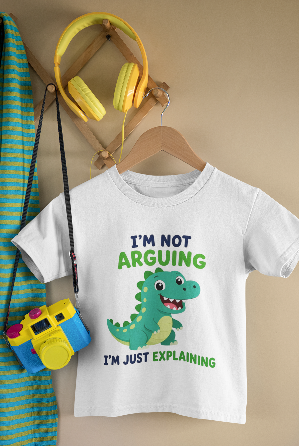 Mini Lawyer Dino T-Shirt White - hanging with camera and headphones