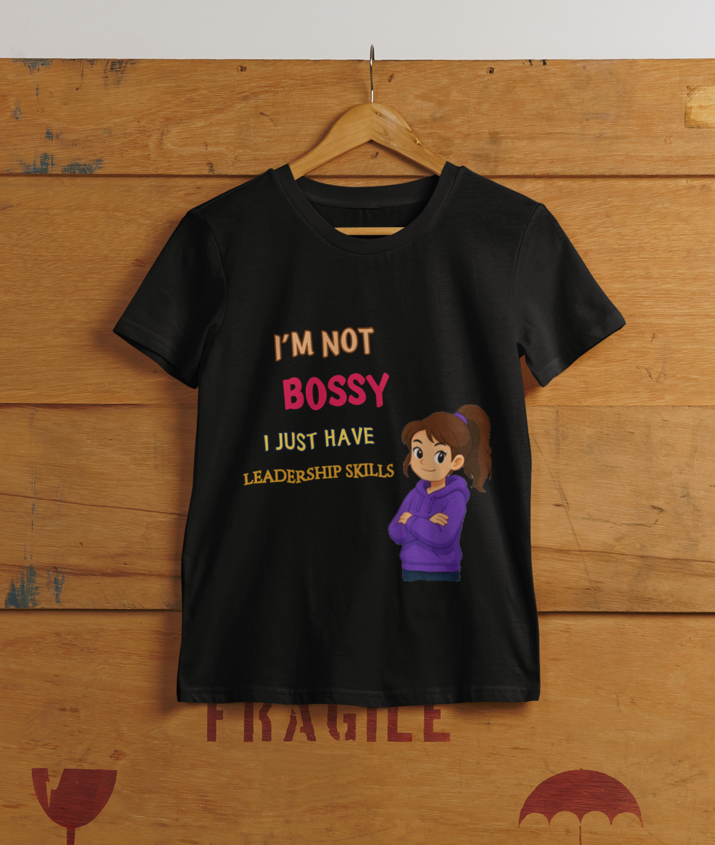 Not Bossy Leadership Tee Black - hanging on cargo box