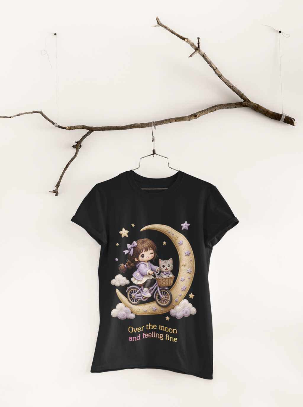 Over The Moon Tee Black - hanging from ornamental branch