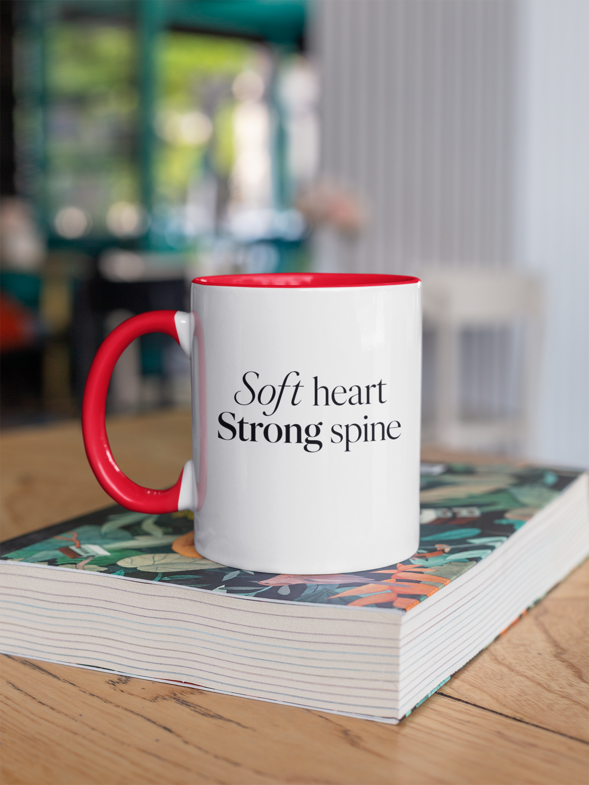 Soft Heart Strong Spine - Red handle mug on book