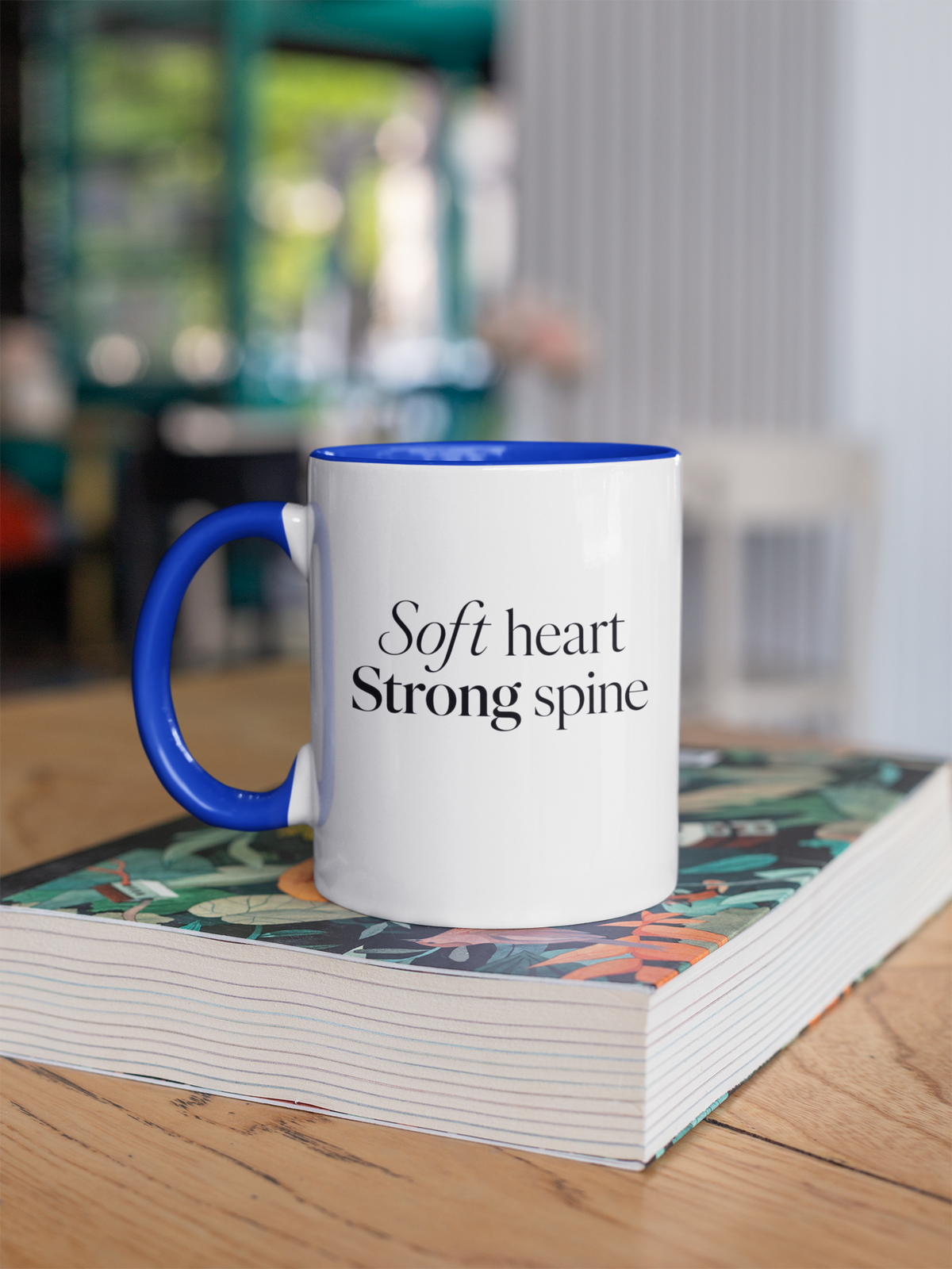 Soft Heart Strong Spine - Royal Blue handle mug on book