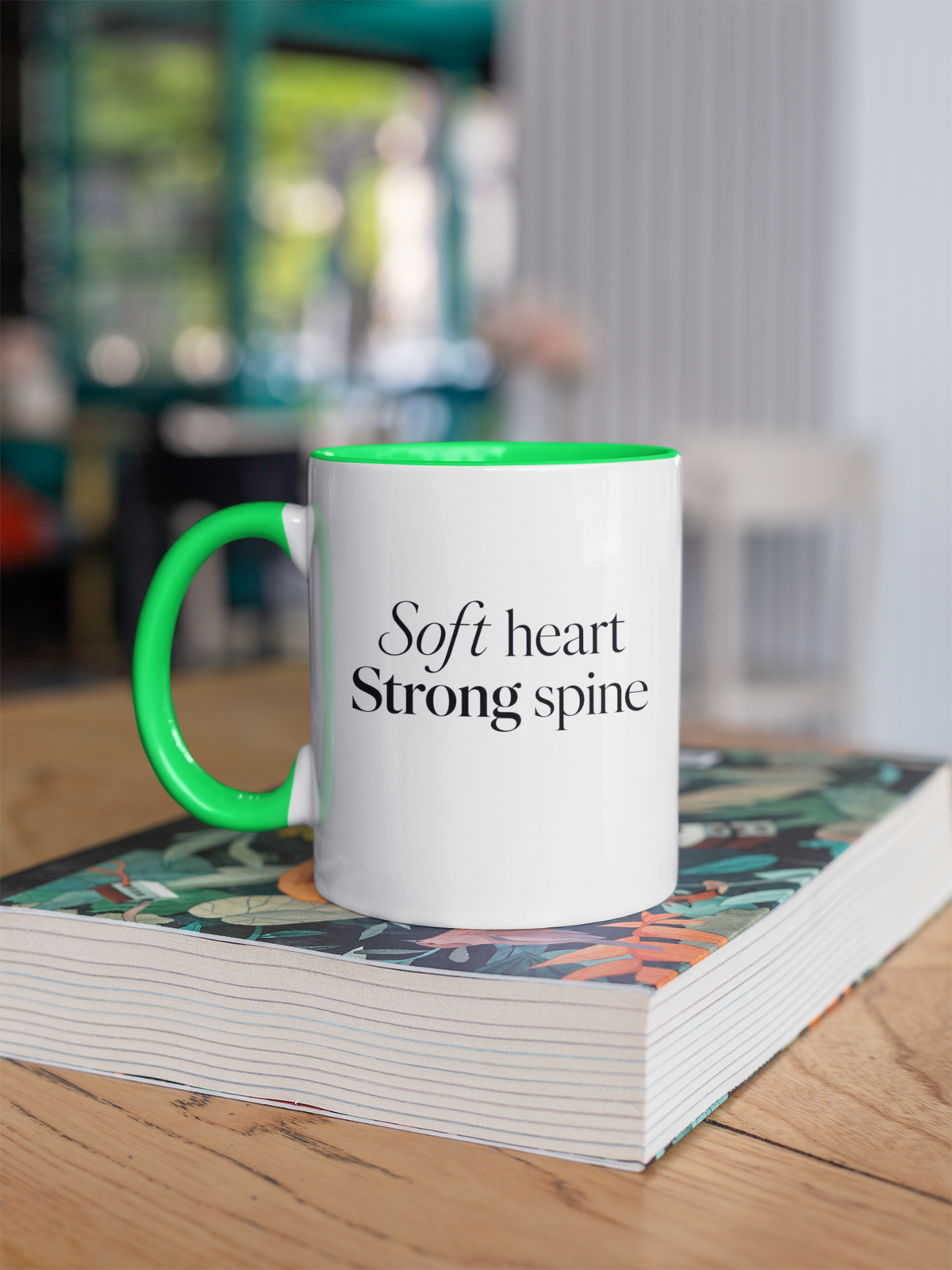 Soft Heart Strong Spine - Green handle mug on book