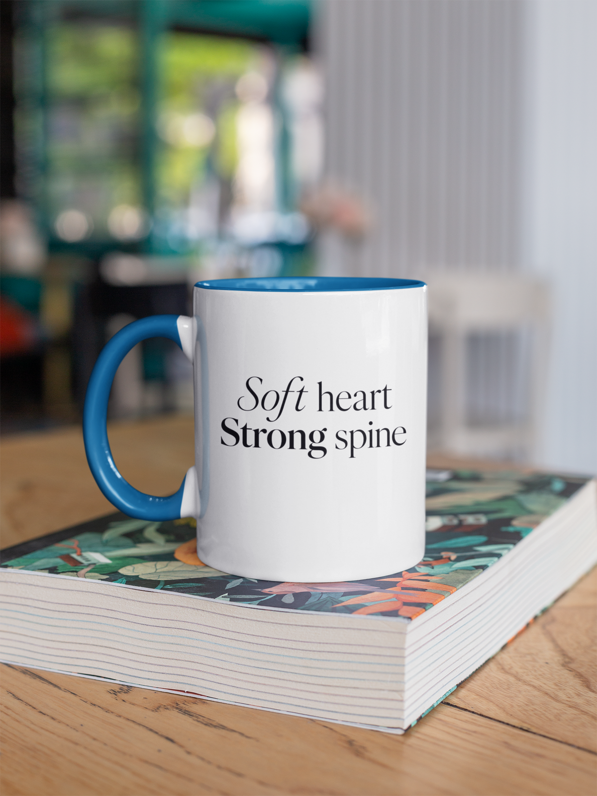 Soft Heart Strong Spine - Steel Blue handle mug on book