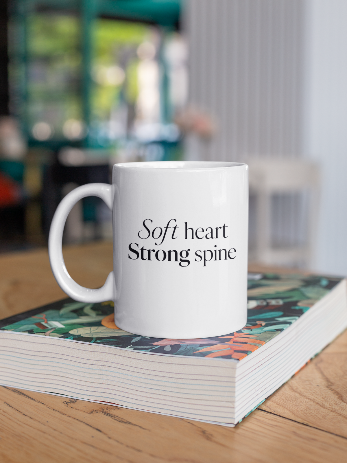 Soft Heart Strong Spine - White mug on book