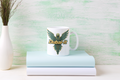 Dubai-it mug on books - teal gold cyber falcon design
