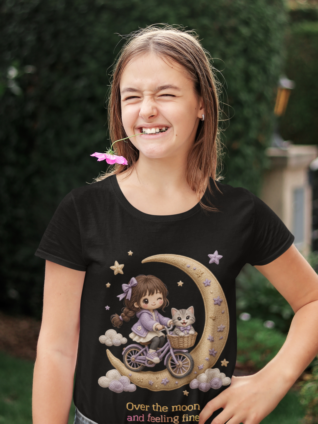 Over The Moon Tee Black - teen girl playing with a flower