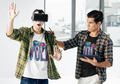 Volt neon gaming white graphic tee two young men trying out VR headset